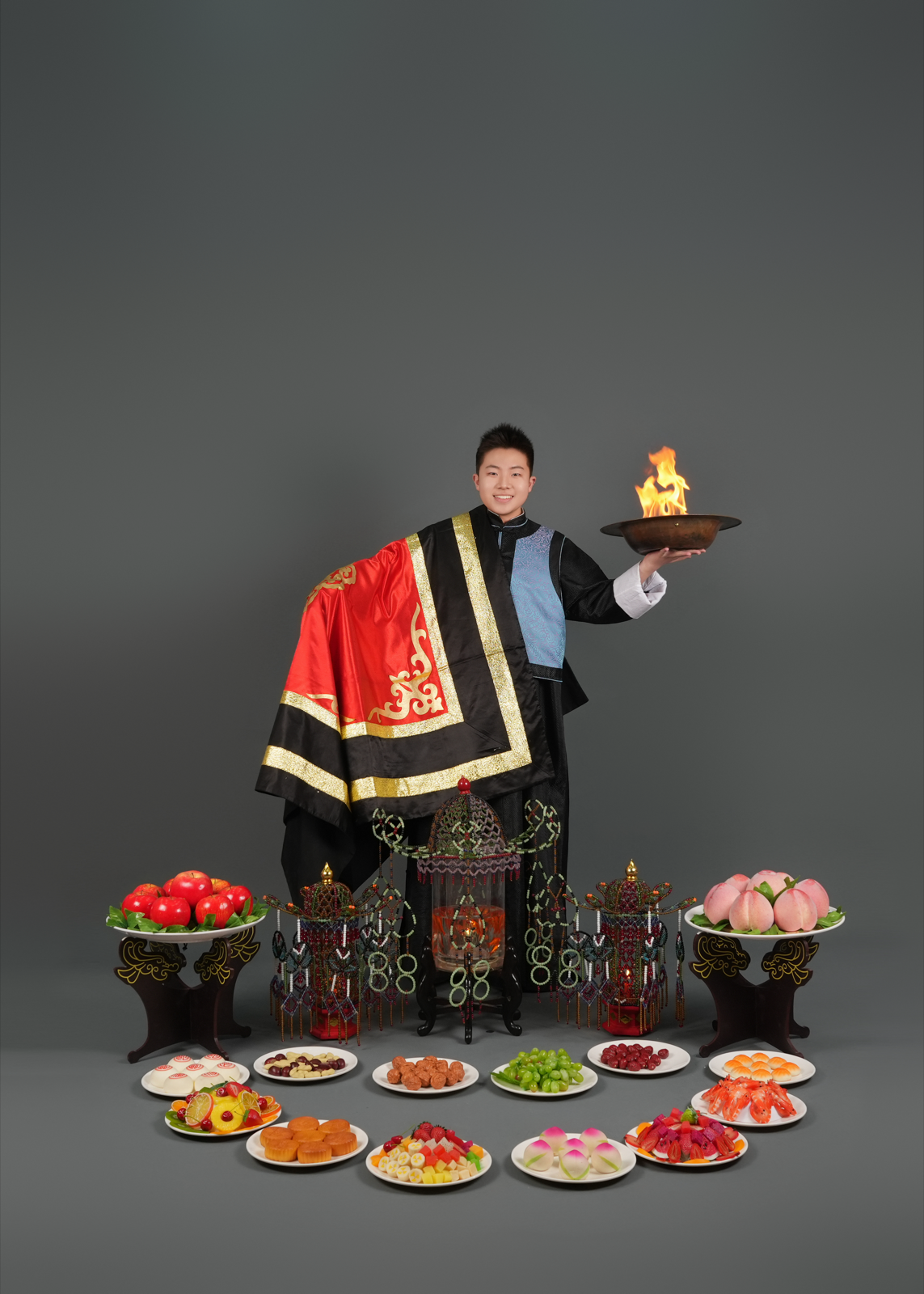 Brian Zhang presenting Chinese Conjuring in traditional stage costume